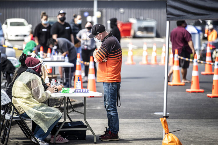 Tue. 9:31 a.m.: New Zealand hits virus high, pushes vaccination as way out